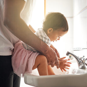 mom and child near sink